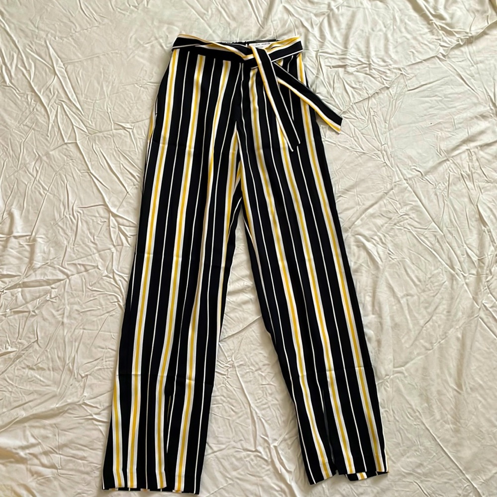 Yellow, black, and white dress pants